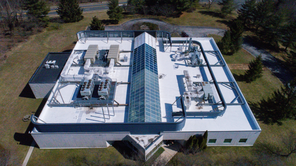 Aerial view of a completed commercial flat roof installation at a cardiovascular healthcare facility.