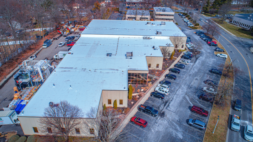 Completed flat roof installation by Hayden Building Maintenance Corp. for a cardiovascular medical center and W&W Glass corporate facility.